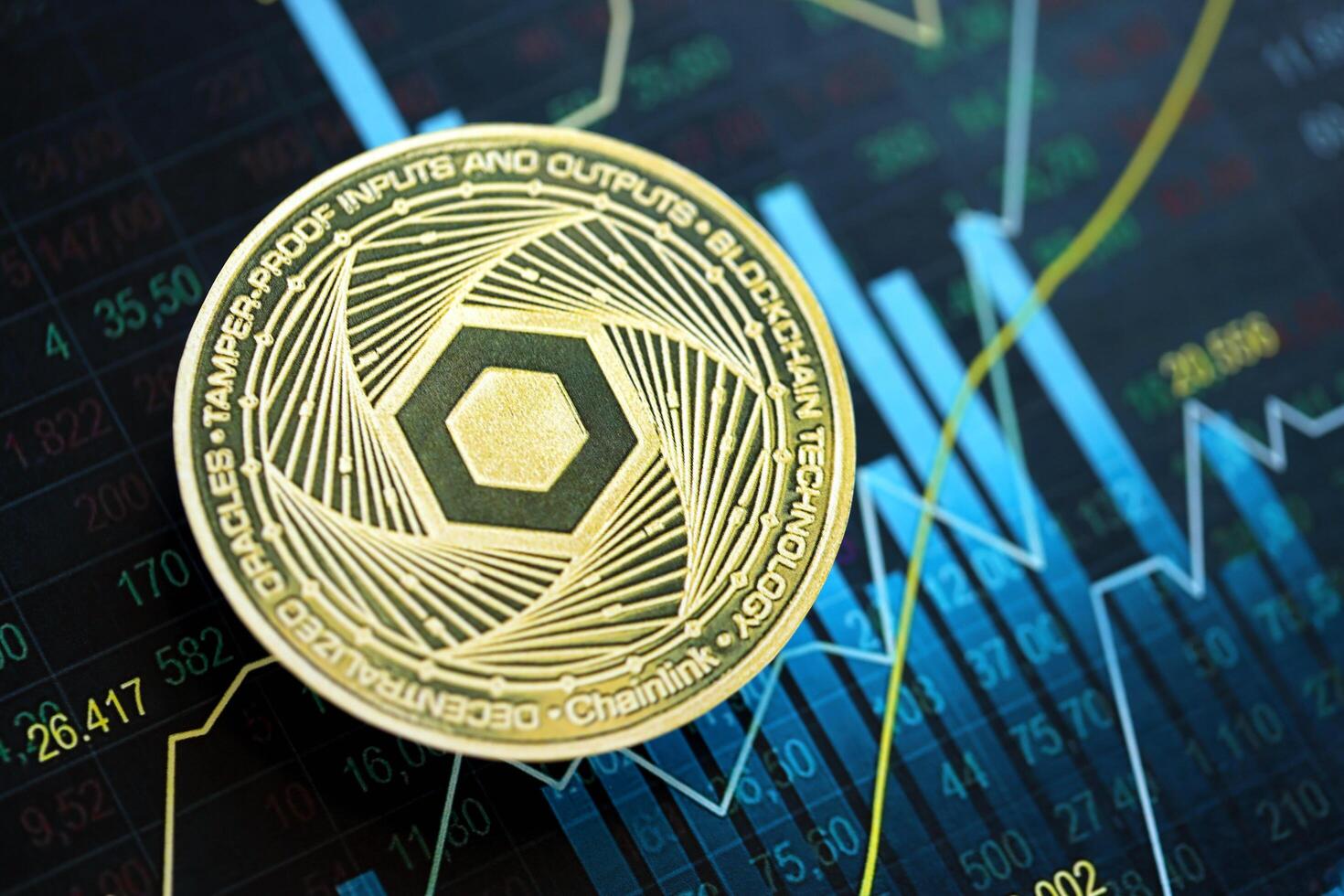 KYIV, UKRAINE - AUGUST 17, 2024 Chainlink LINK coin on abstract fictional candlesticks in trading chart in blue color photo