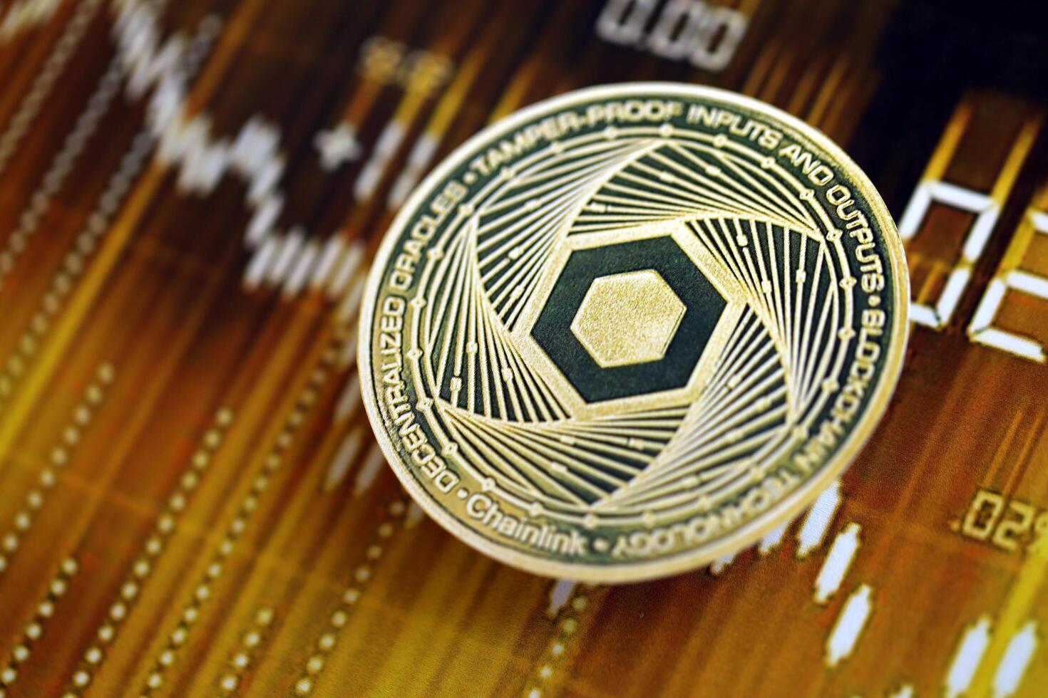 KYIV, UKRAINE - AUGUST 17, 2024 Chainlink LINK coin on dark cryptocurrency digital trading chart in golden yellow colors photo