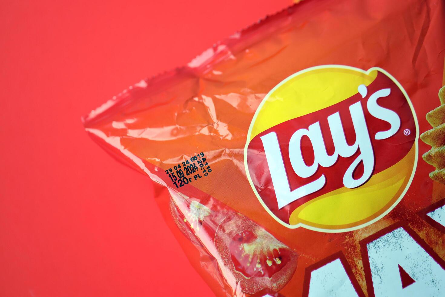 KYIV, UKRAINE - AUGUST 17, 2024 Lays MAX potato chips with pepper flavour photo