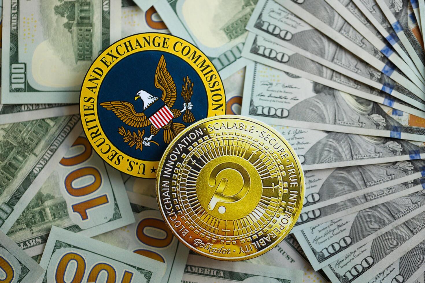 KYIV, UKRAINE - AUGUST 17, 2024 PolkaDot coin and US Securities and Exchange Commission sign on money background photo