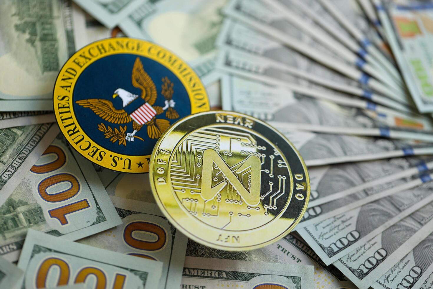 KYIV, UKRAINE - AUGUST 17, 2024 NEAR coin and US Securities and Exchange Commission sign on money background photo