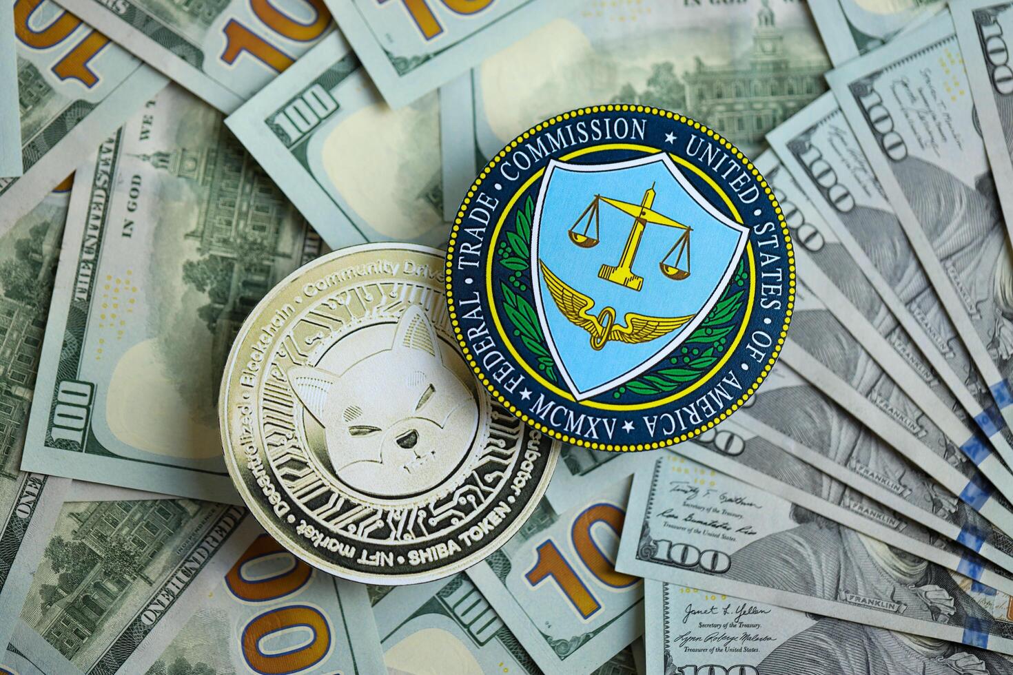 KYIV, UKRAINE - AUGUST 17, 2024 Shiba coin and US Federal Trade Commission sign on many USD dollar money bills photo