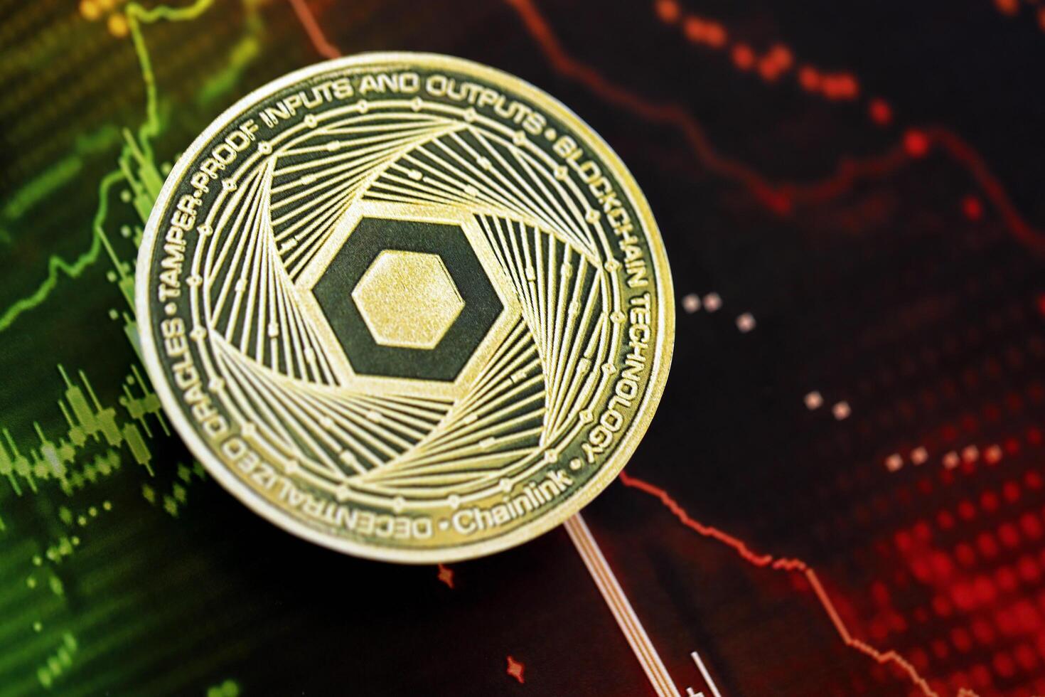 KYIV, UKRAINE - AUGUST 17, 2024 Chainlink LINK coin on dark cryptocurrency digital trading chart in green and red colors photo
