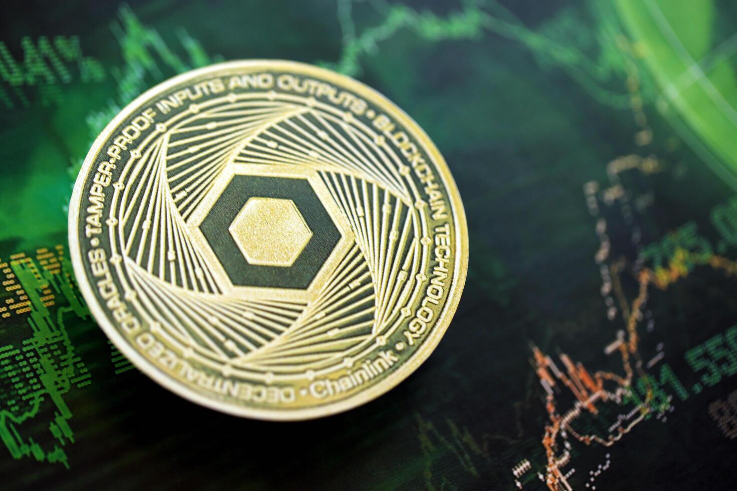 KYIV, UKRAINE - AUGUST 17, 2024 Chainlink LINK coin on dark cryptocurrency digital trading chart in green colors photo
