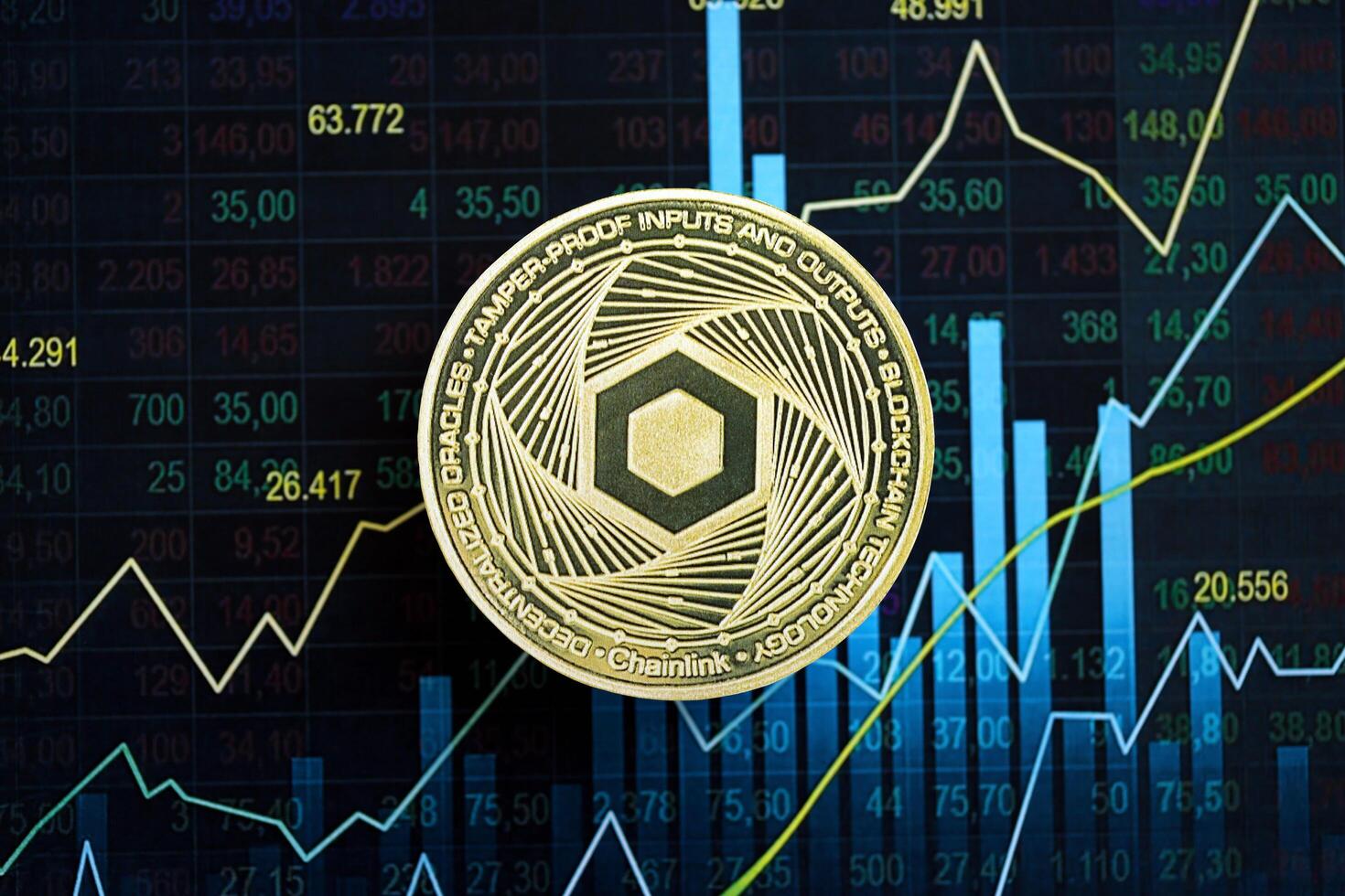 KYIV, UKRAINE - AUGUST 17, 2024 Chainlink LINK coin on abstract fictional candlesticks in trading chart in blue color photo