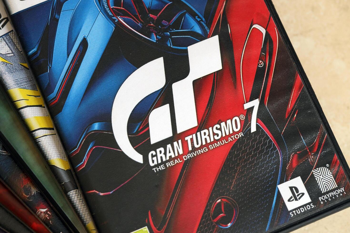 KYIV, UKRAINE - JUNE 26, 2024 Gran Turismo 7 PS5 game disc box for console gaming. Popular game disc photo