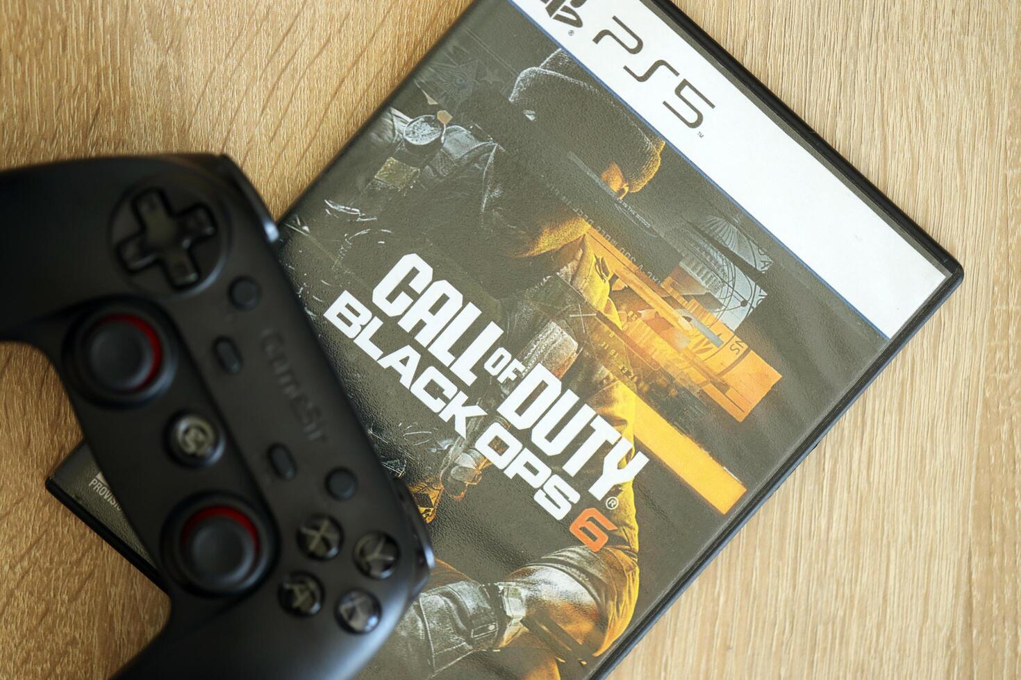 KYIV, UKRAINE - JUNE 26, 2024 Call of Duty Black Ops 6 PS5 game disc box for console gaming. Popular game disc photo