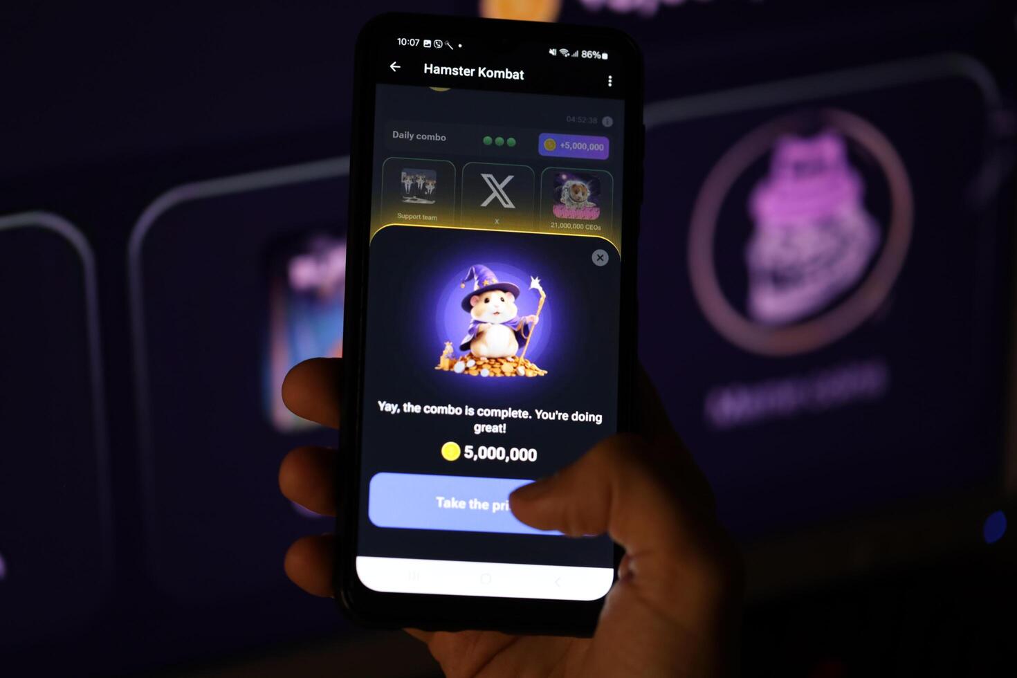 KYIV, UKRAINE - APRIL 20, 2024 Hamster Kombat telegram bot on smartphone screen. Hamster Kombat is a viral Telegram-based crypto game for earn HMSTR tokens by managing virtual crypto exchange photo