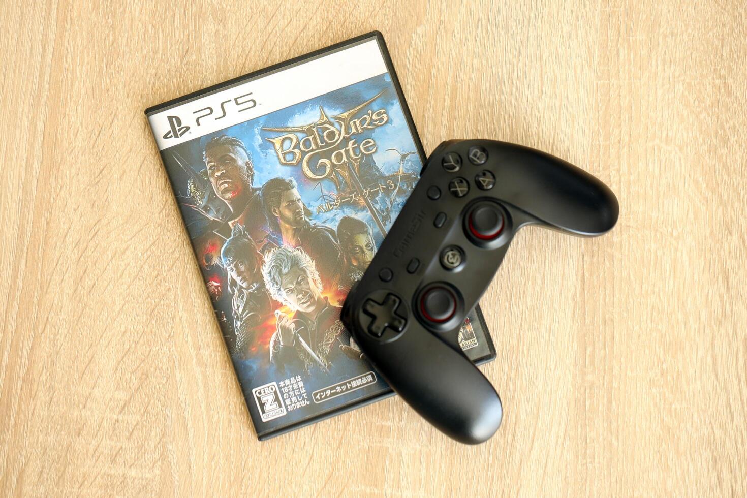 KYIV, UKRAINE - JUNE 26, 2024 Baldur's Gate 3 PS5 game disc box for console gaming. Popular game disc photo