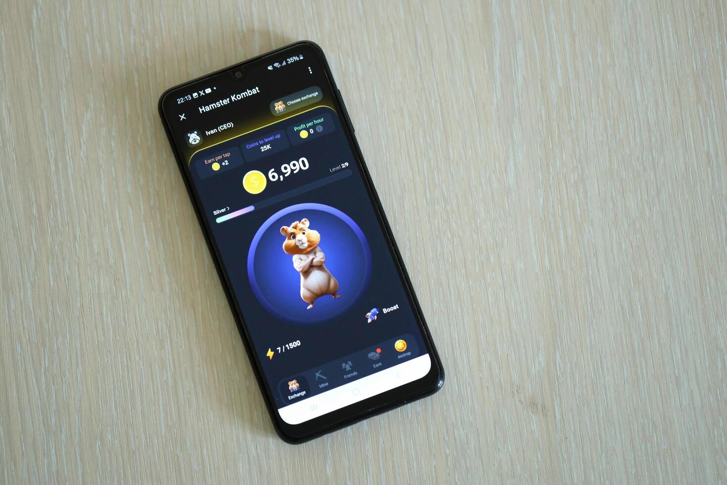 KYIV, UKRAINE - APRIL 20, 2024 Hamster Kombat telegram bot on smartphone screen. Hamster Kombat is a viral Telegram crypto game for earn HMSTR tokens by managing virtual crypto exchange photo