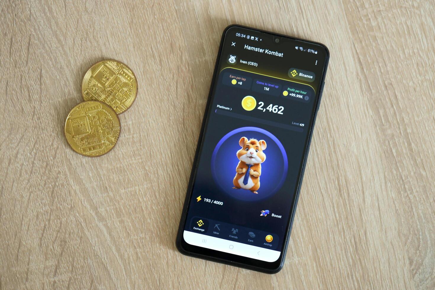 KYIV, UKRAINE - APRIL 20, 2024 Hamster Kombat telegram bot on smartphone screen. Hamster Kombat is a viral Telegram crypto game for earn HMSTR tokens by managing virtual crypto exchange photo
