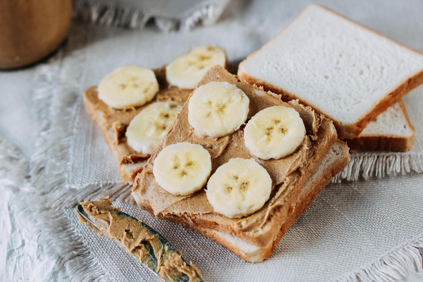 sandwich with peanut butter and bananas. Healthy and tasty breakfast or snack. photo