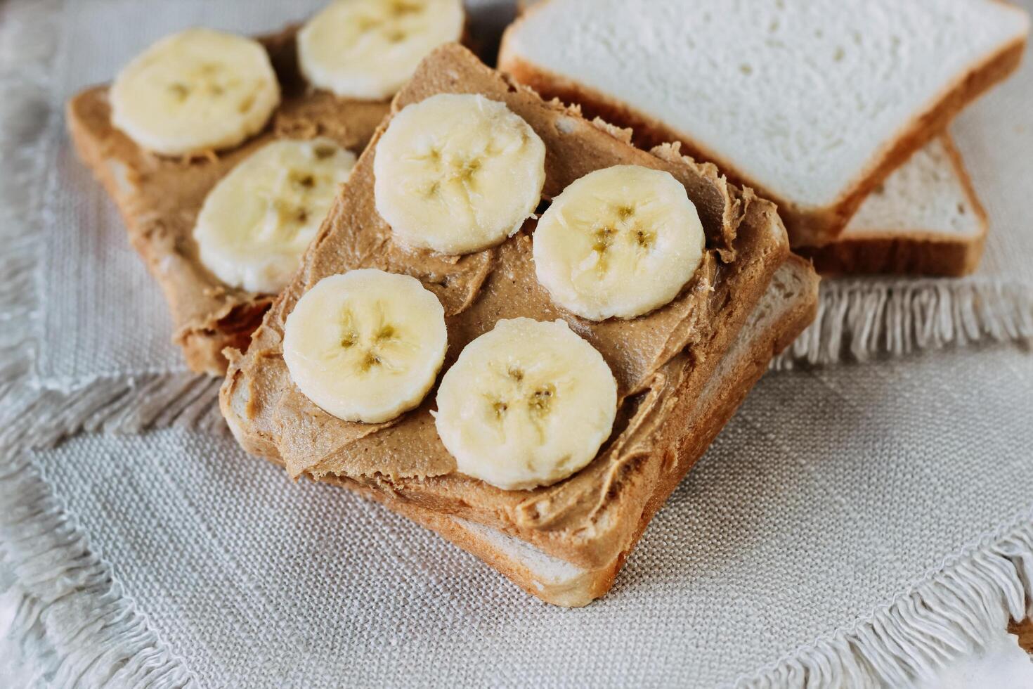 sandwich with peanut butter and bananas. Healthy and tasty breakfast or snack. photo