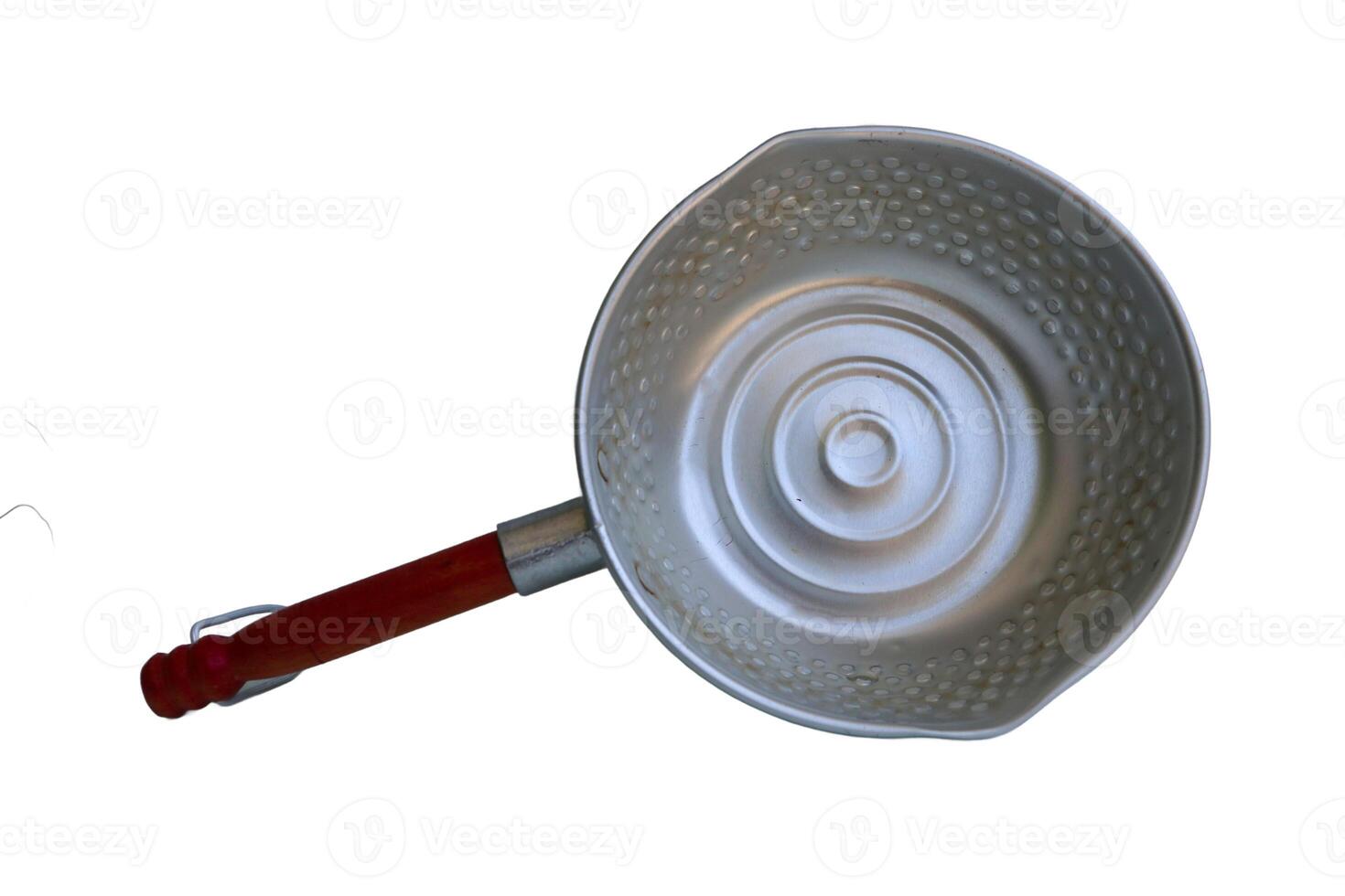 A silver pan with a wooden handle sits on a white background. The pan is empty and has a circular shape photo