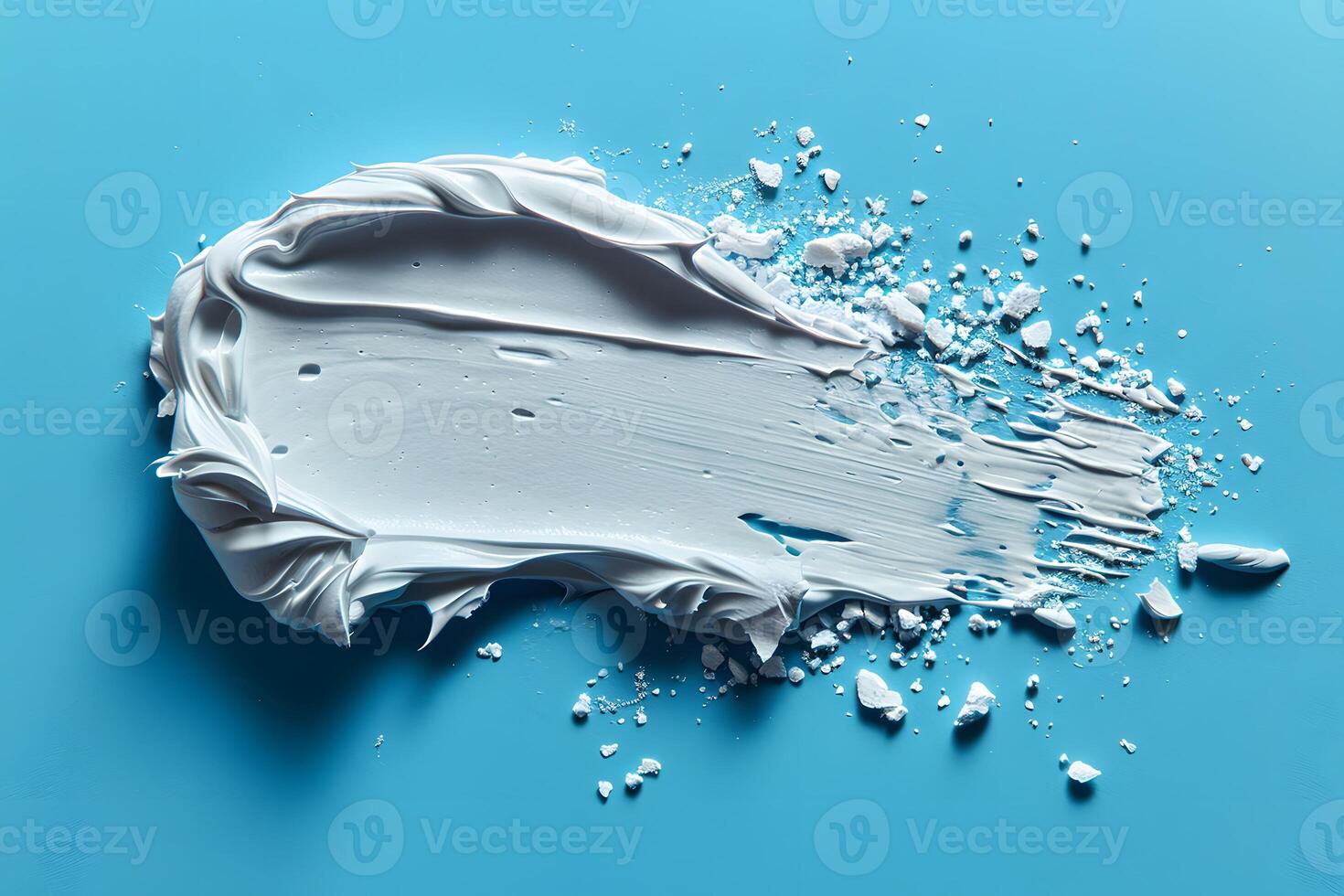Artistic Smear of White Cream on Blue Background for Design Concept and Creative Abstract Art photo