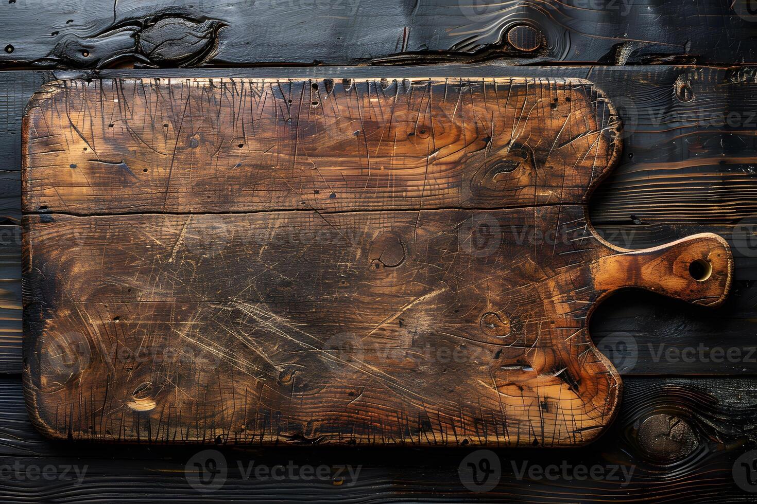 Rustic Wooden Cutting Board with Handle on Dark Weathered Surface - Perfect for Kitchen Art Design and Print photo