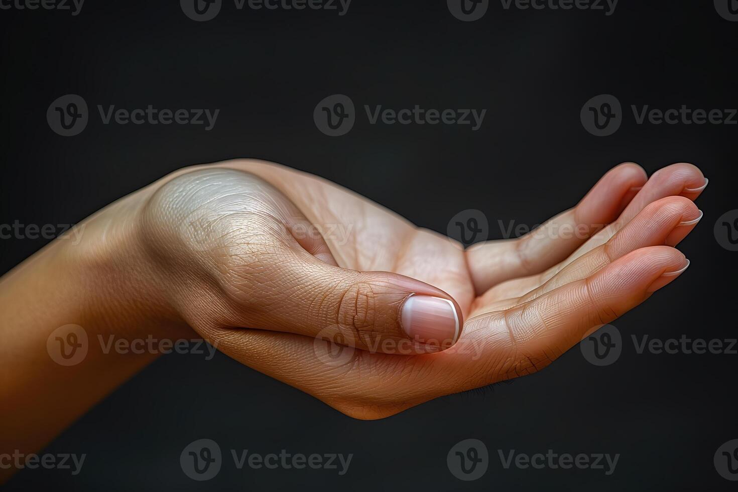 Open Hand Gesture Against Dark Background for Conceptual, Communication, or Design Use photo