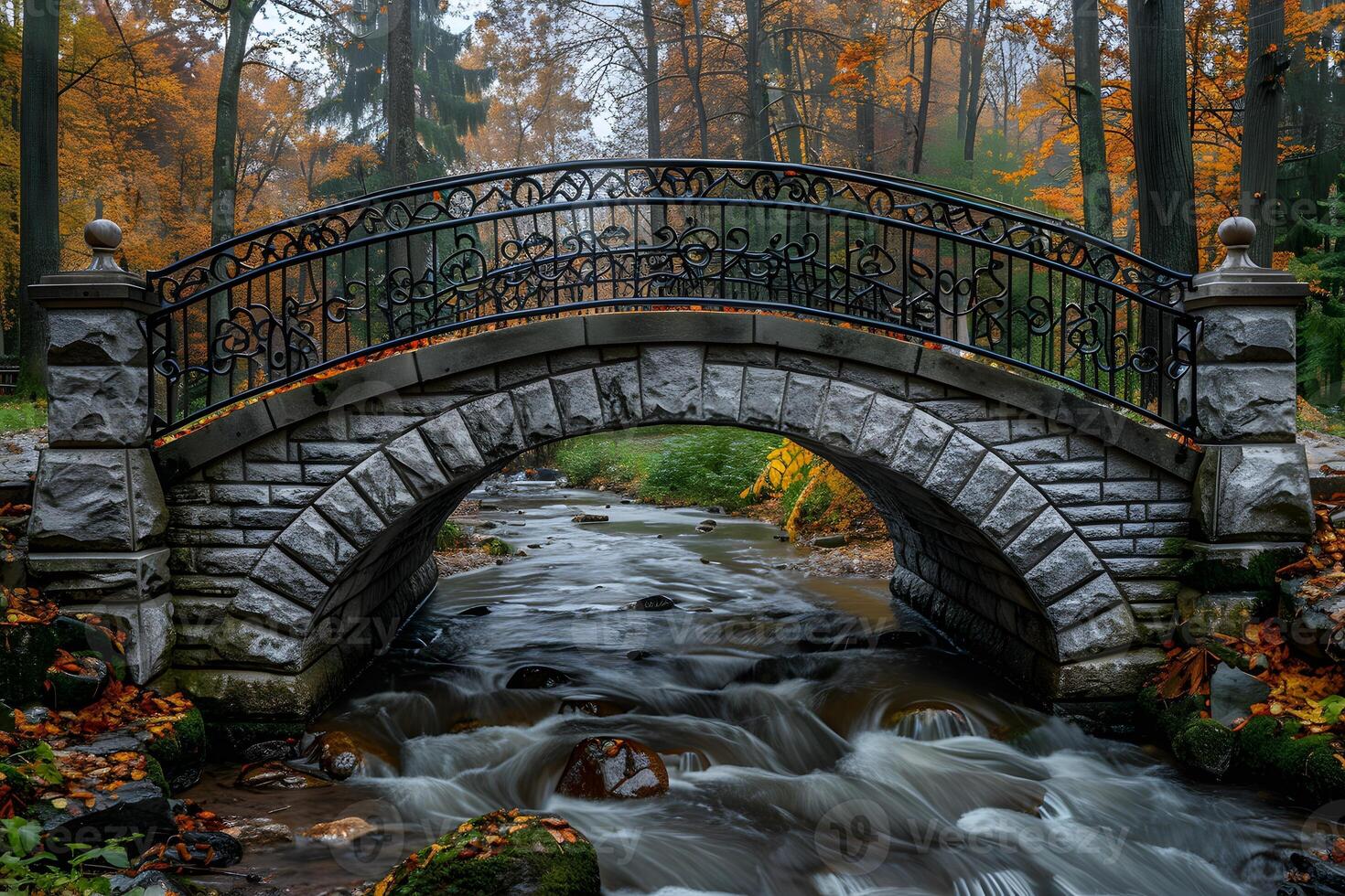 Scenic Autumn Bridge Over Flowing Stream in Serene Park Landscape for Nature Prints and Posters photo