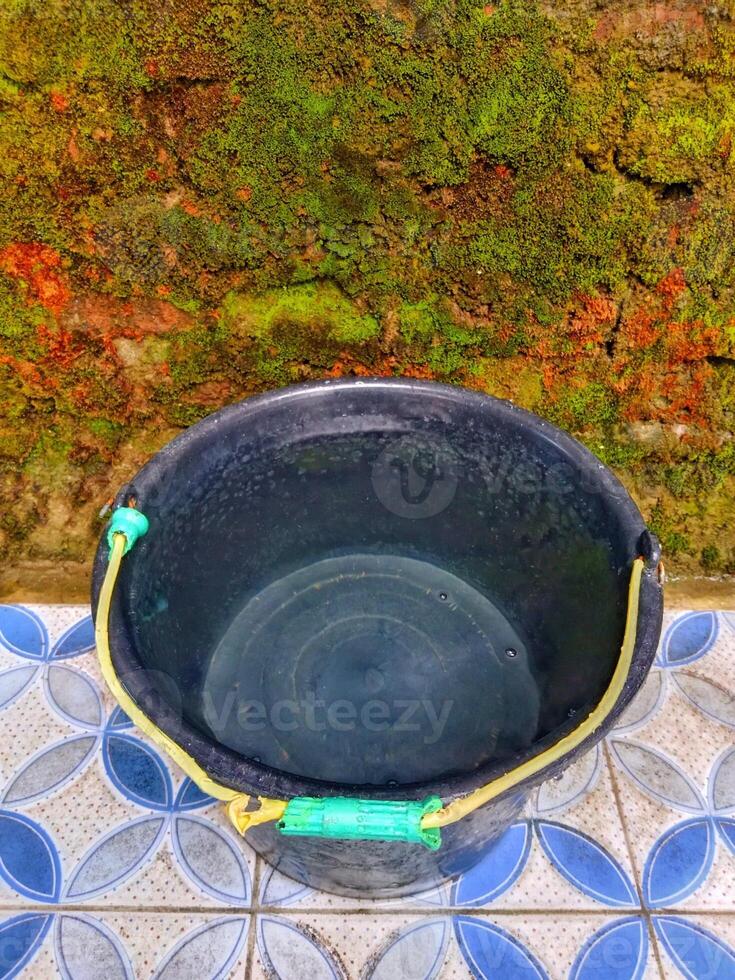 bucket filled with water photo