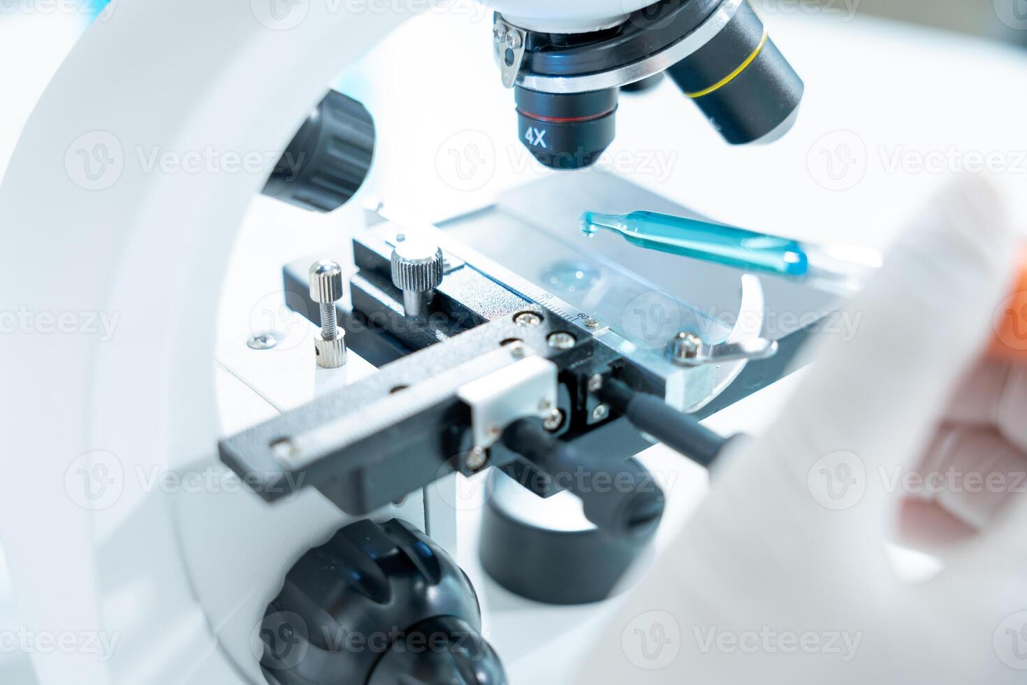 Scientist analyze biochemical samples in advanced scientific laboratory. Medical professional use microscope look microbiological developmental of viral. Biotechnology research in science lab. photo