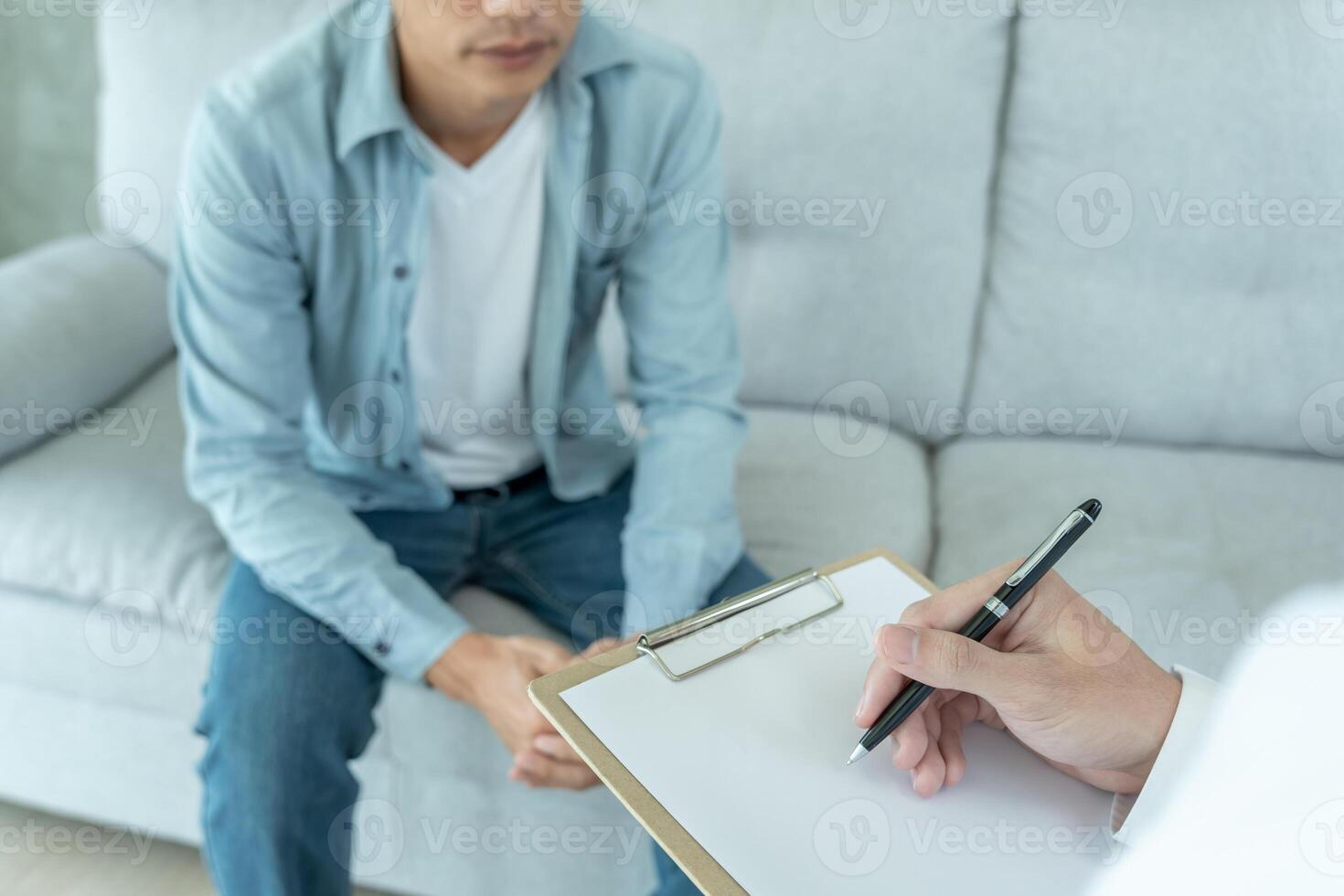 man with mental health problems is consulting. psychiatrist is recording the patient's condition for treatment. encouragement, love and family problem, bipolar , depression patient, protect suicide photo