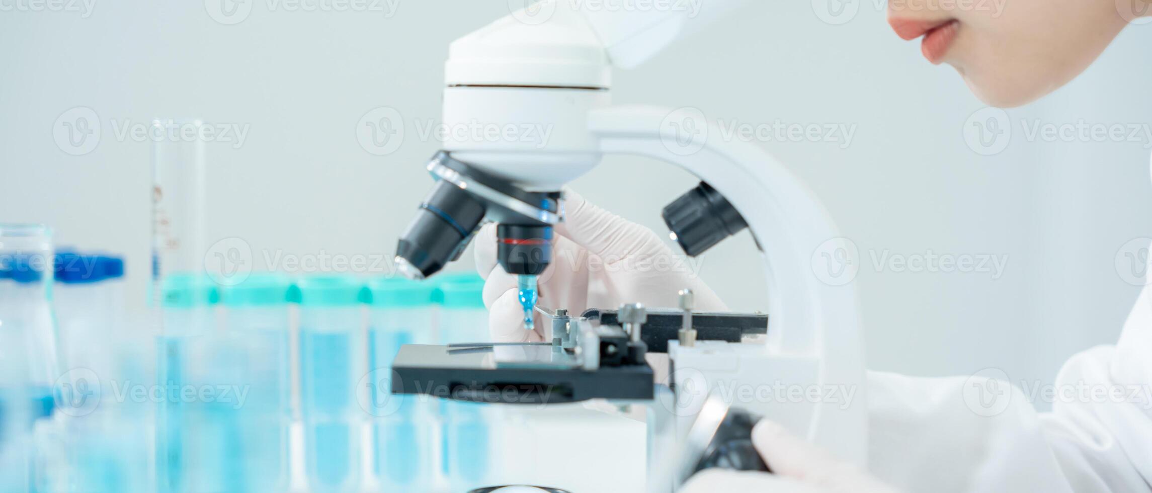 Scientist analyze biochemical samples in advanced scientific laboratory. Medical professional use microscope look microbiological developmental of viral. Biotechnology research in science lab. photo