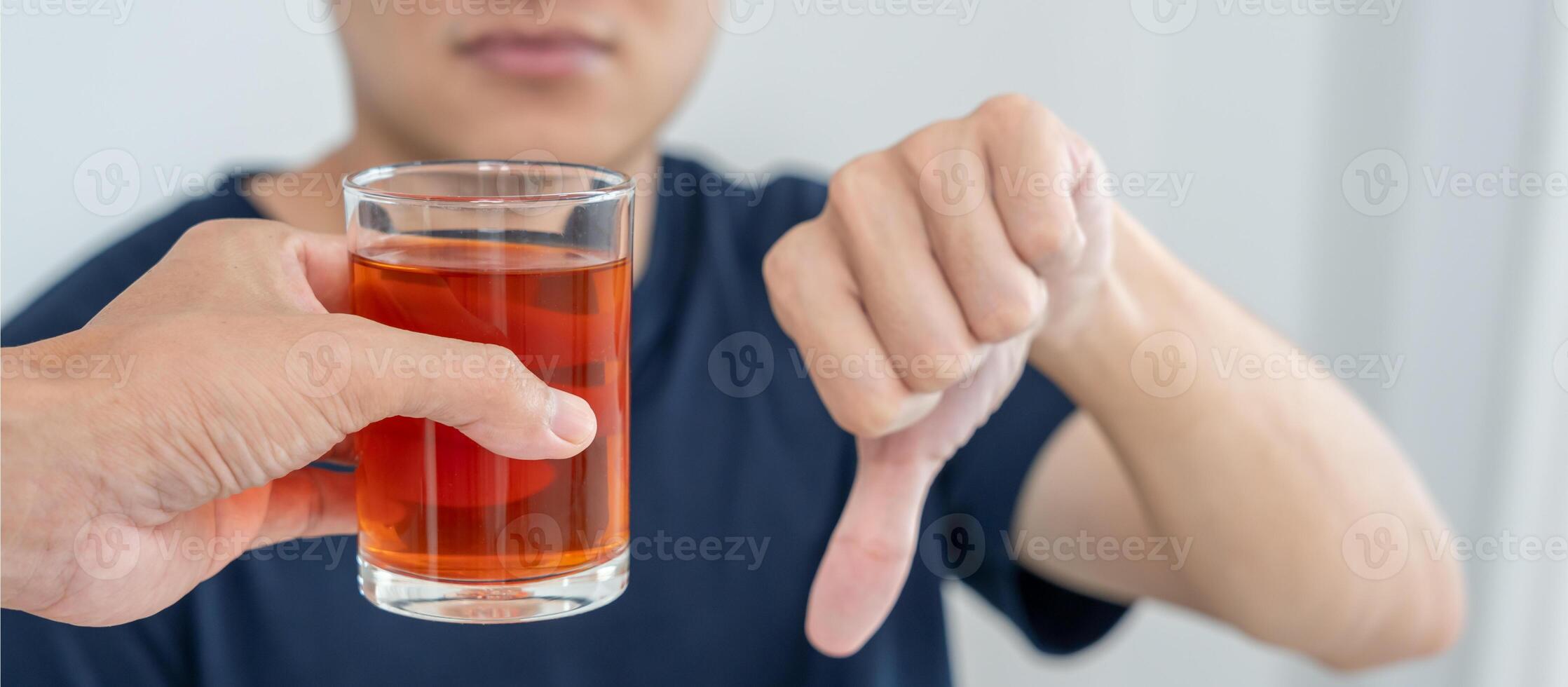 man refuses say no and avoid to drink an alcohol whiskey , stopping hand sign male, alcoholism treatment, alcohol addiction, quit booze, Stop Drinking Alcohol. Refuse Glass liquor, unhealthy, reject photo