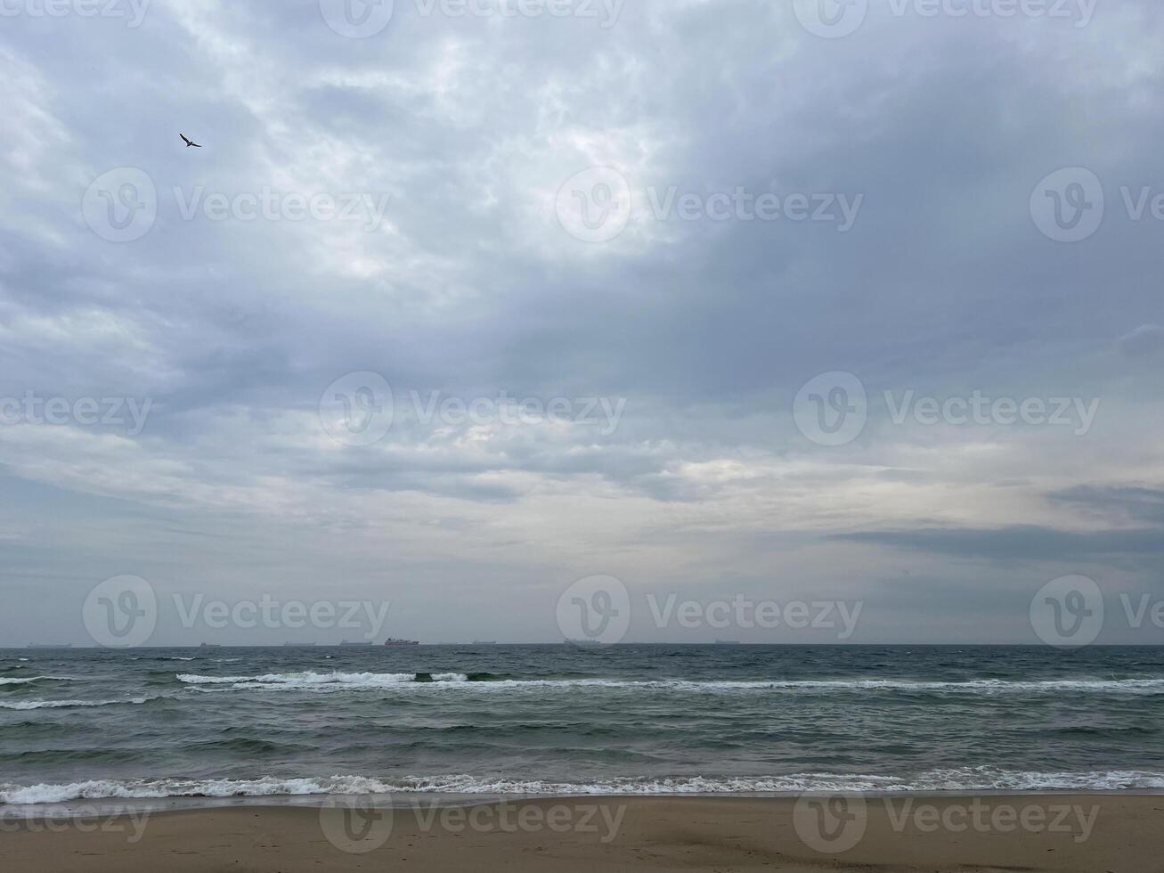 Seascape under a cloudy sky. Skagerrak, Kattegat strait in Skagen, Denmark photo