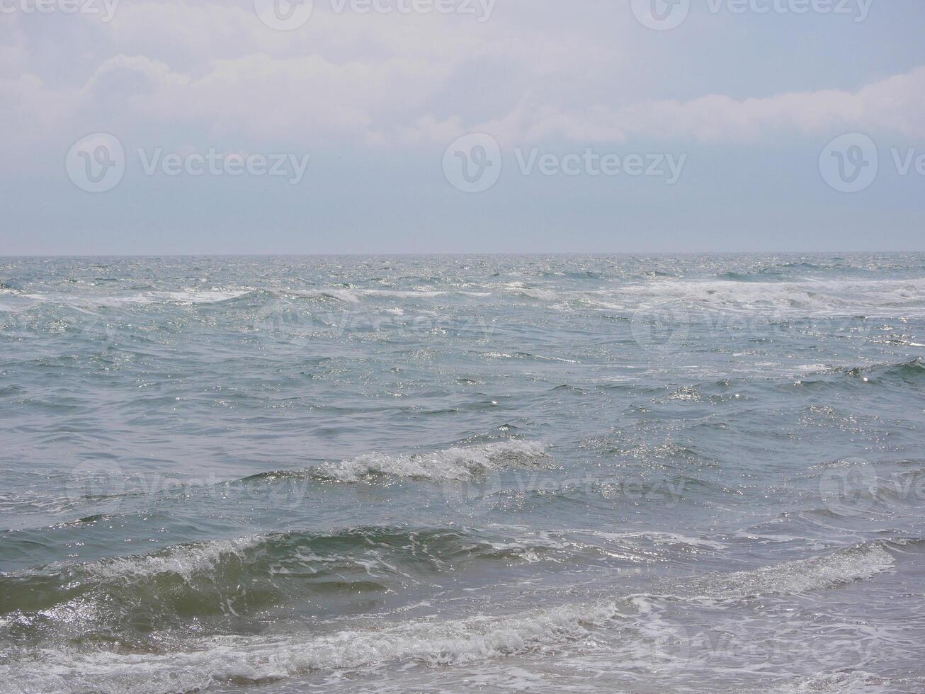 Seascape under a cloudy sky. Skagerrak, Kattegat strait in Skagen, Denmark photo