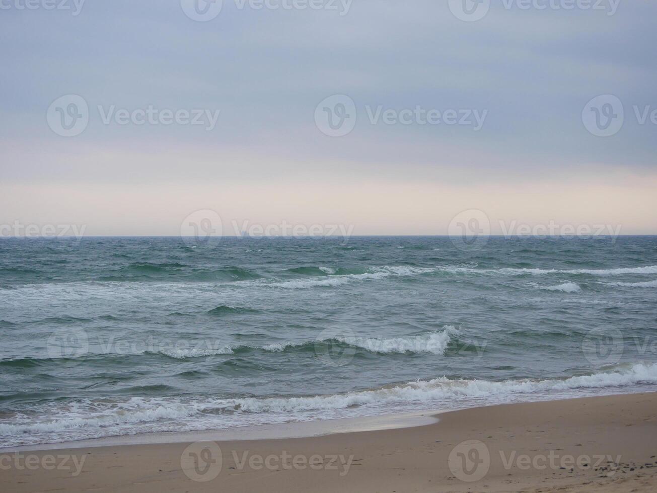 Seascape under a cloudy sky. Skagerrak, Kattegat strait in Skagen, Denmark photo