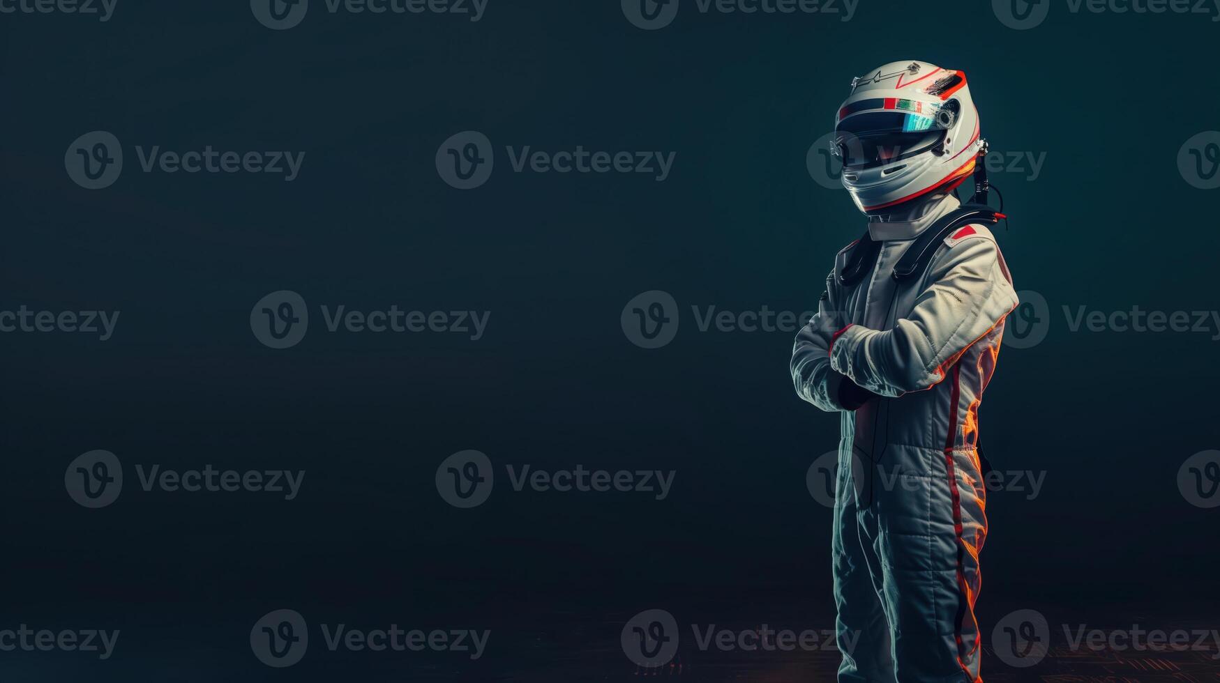 Medium Shot Of Standing Racing Driver In White Helmet And Suit With Arms Crossed photo