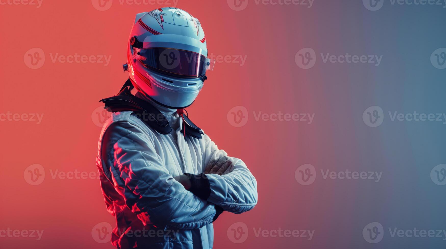 Confident Racing Driver in Helmet and Suit Standing with Arms Crossed in Studio Lighting photo