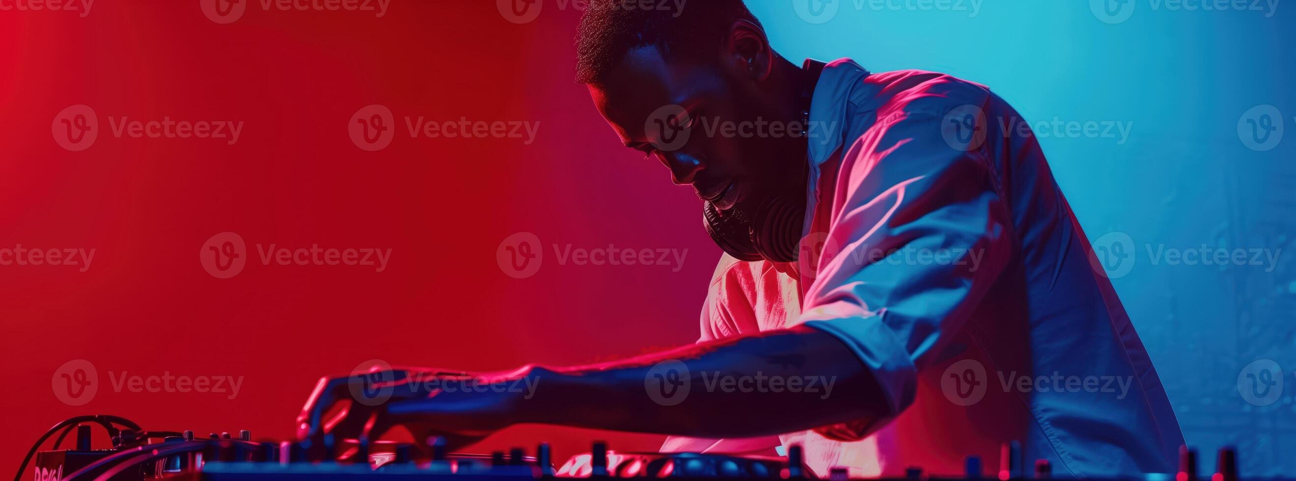 DJ Playing at Nightclub with Dynamic Lighting and Vibrant Atmosphere photo