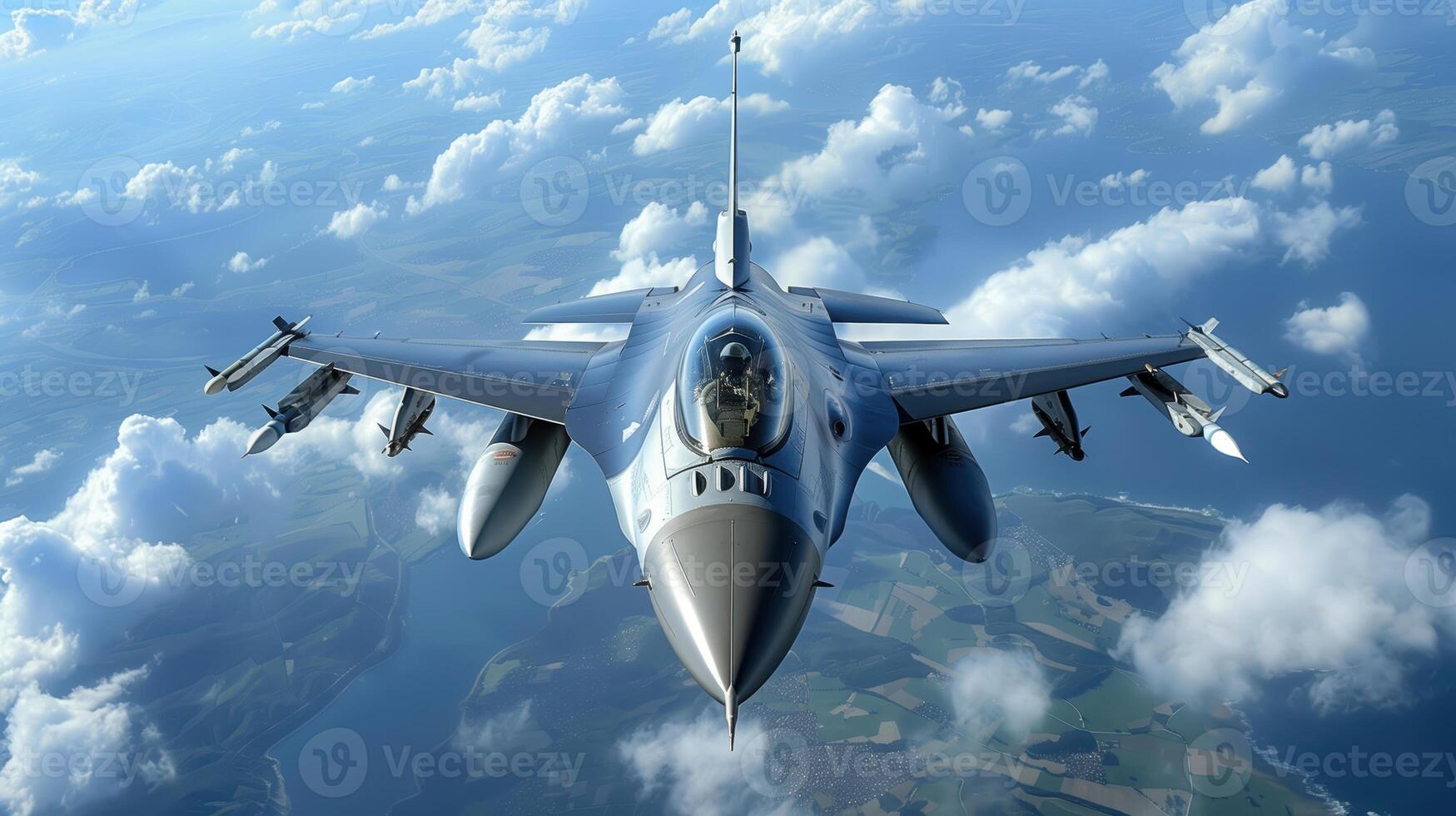 Aerial View of F-16 Fighter Jet Flying Over Clouds and Coastal Landscape photo