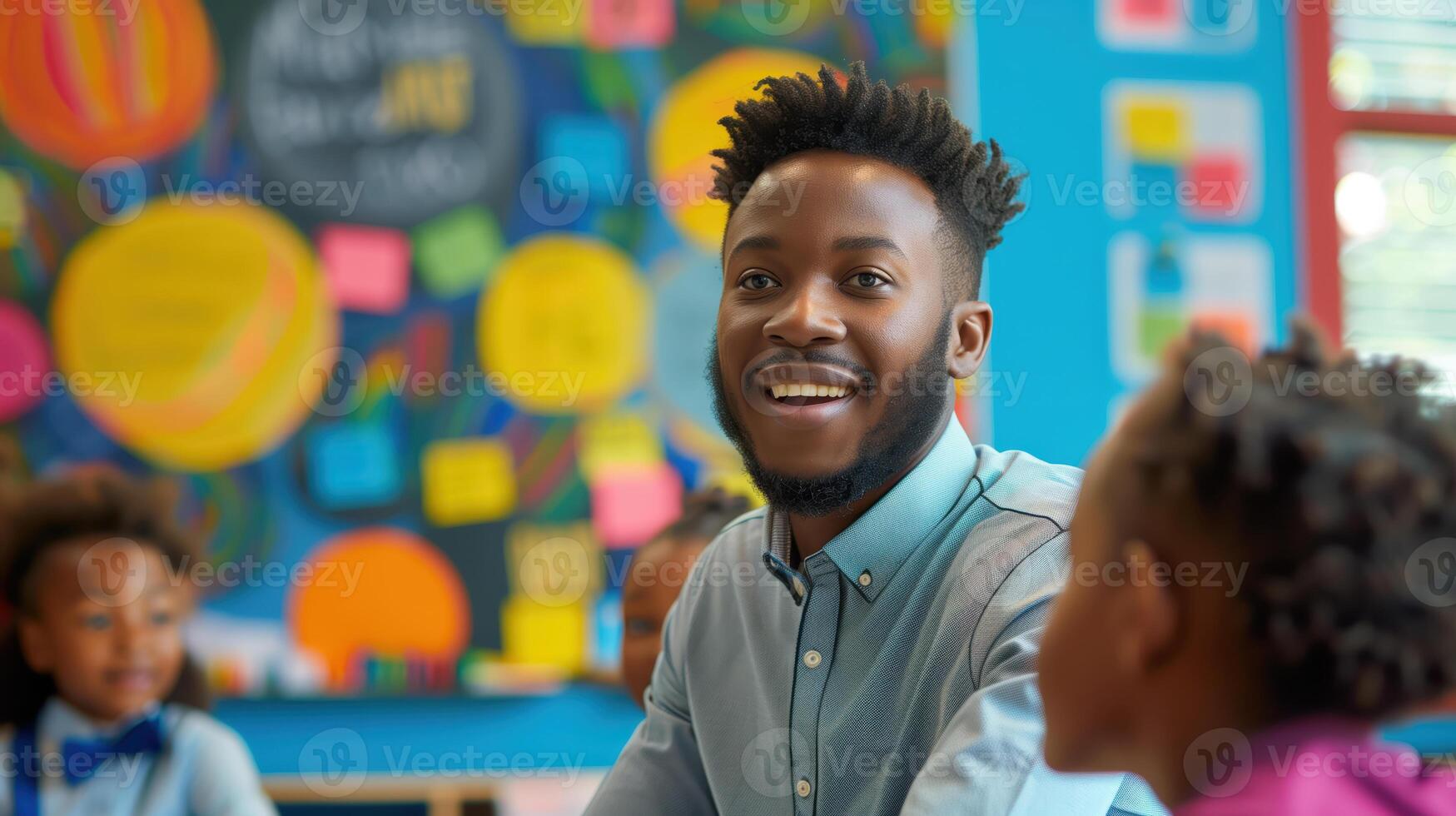 Smiling African American Teacher Engaging with Students in a Colorful Classroom Setting photo
