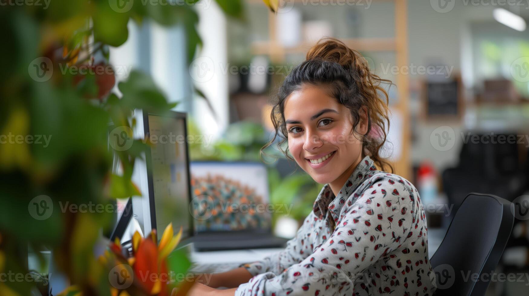 Smiling Woman Enjoying IT Services in a Bright Modern Office with Lush Greenery and Natural Light photo