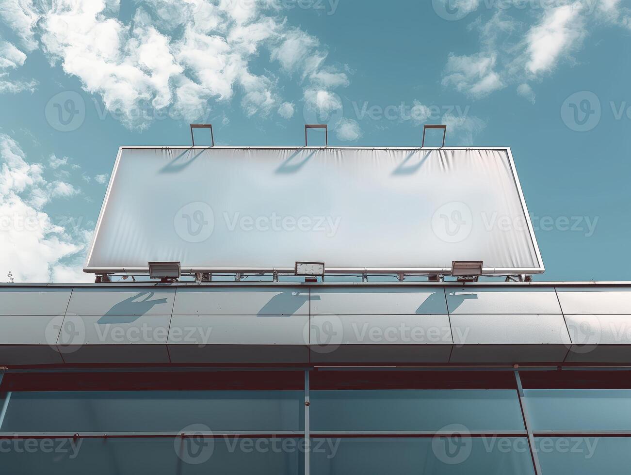 Low Angle View of a Blank Billboard Against a Clear Blue Sky for Advertising and Promotions photo