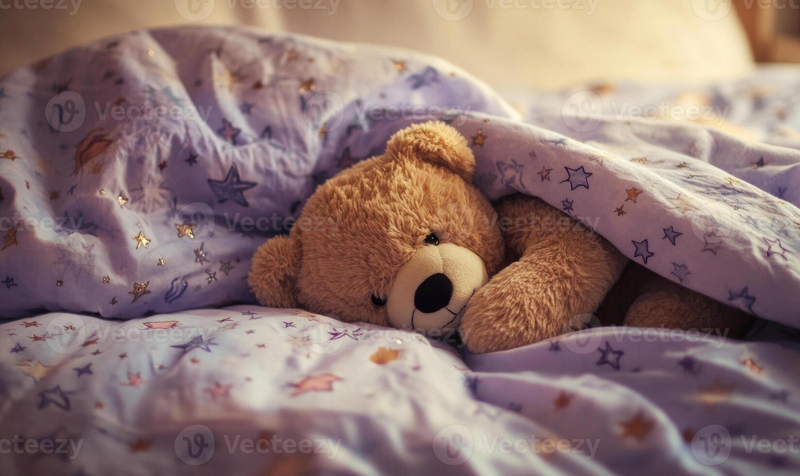 Teddy bear nestled in blankets photo