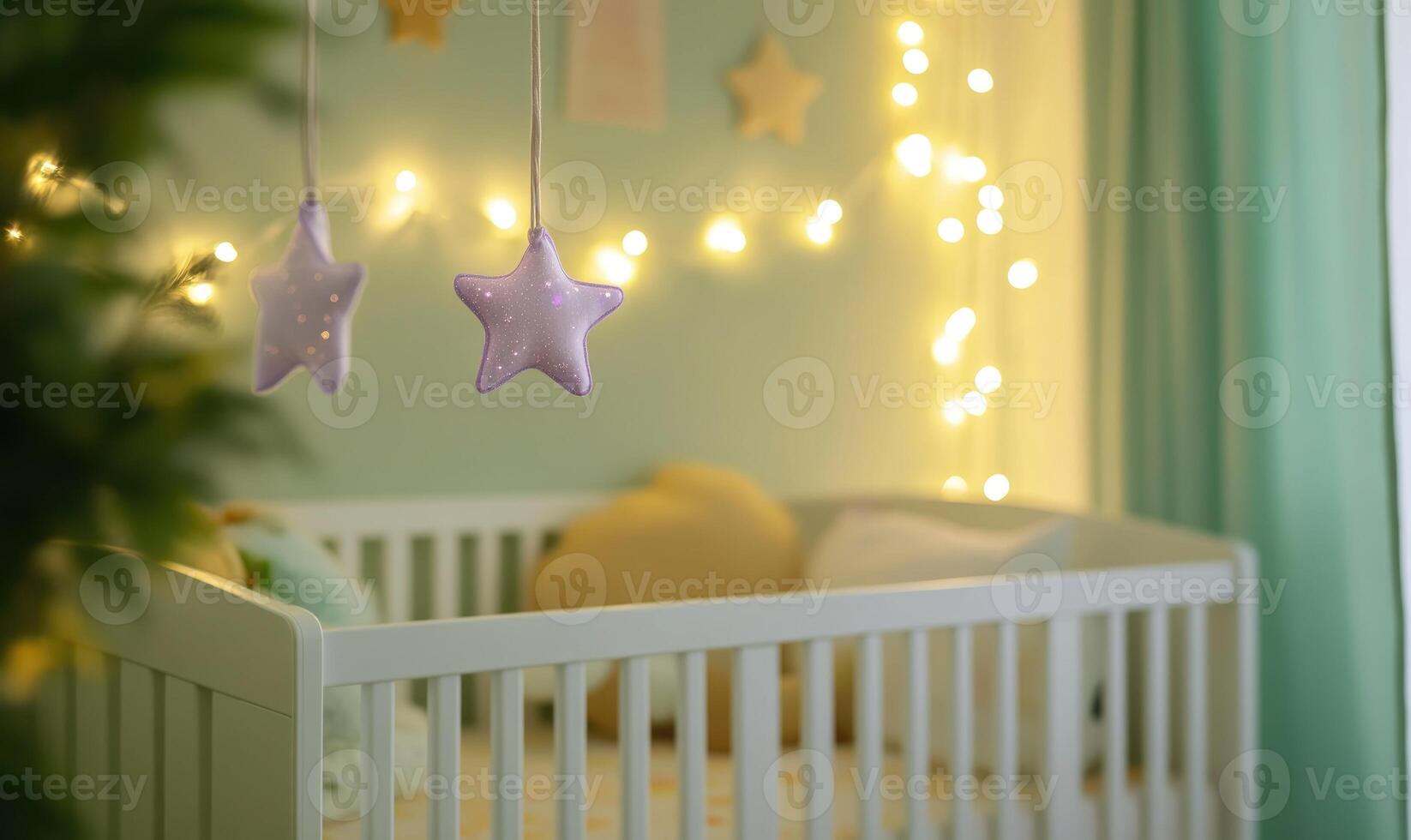 White crib with starry mobile photo