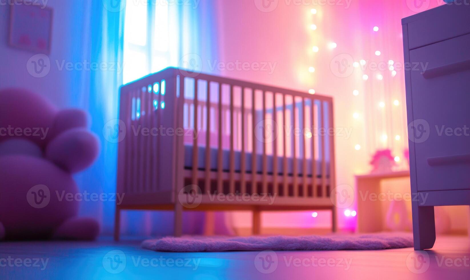 Wooden crib in a light blue nursery, glowing pink and purple lights photo