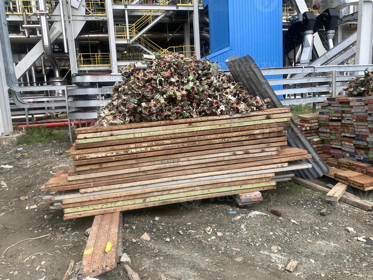 Lot of Asiba scaffolding and double clamp lay on the site power plant area. photo