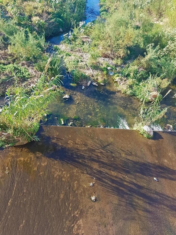 A view from the top to the beauty of landscapes and water flows, a journey to the heart of nature photo