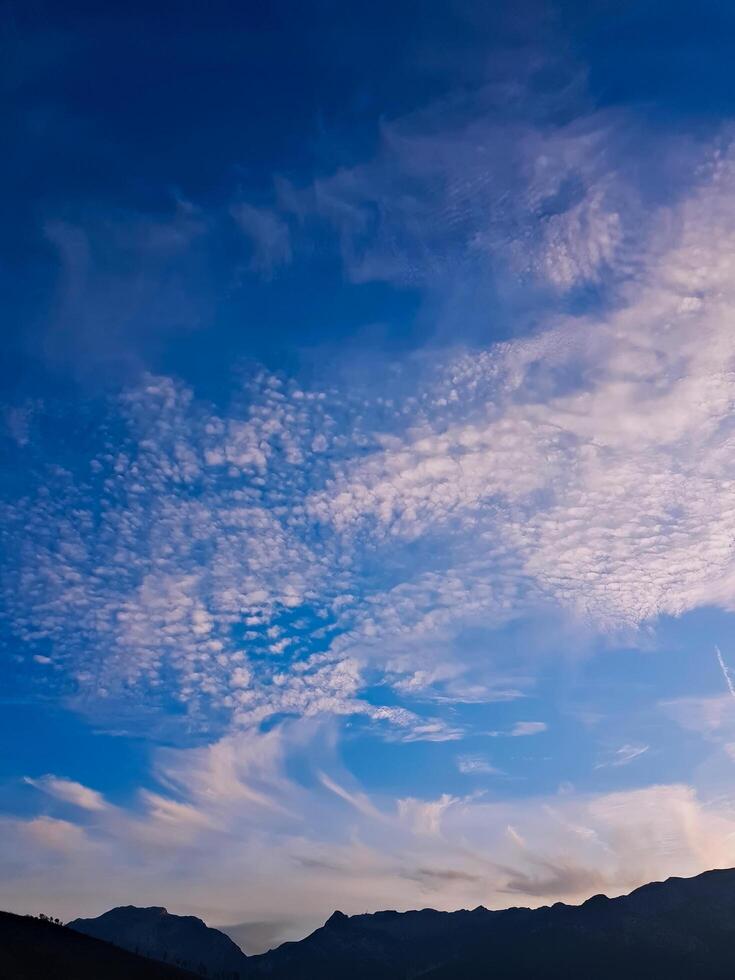 Skyscape embraces clouds in vibrant colors, sunlight feels cloudy, looks at the endless sky photo
