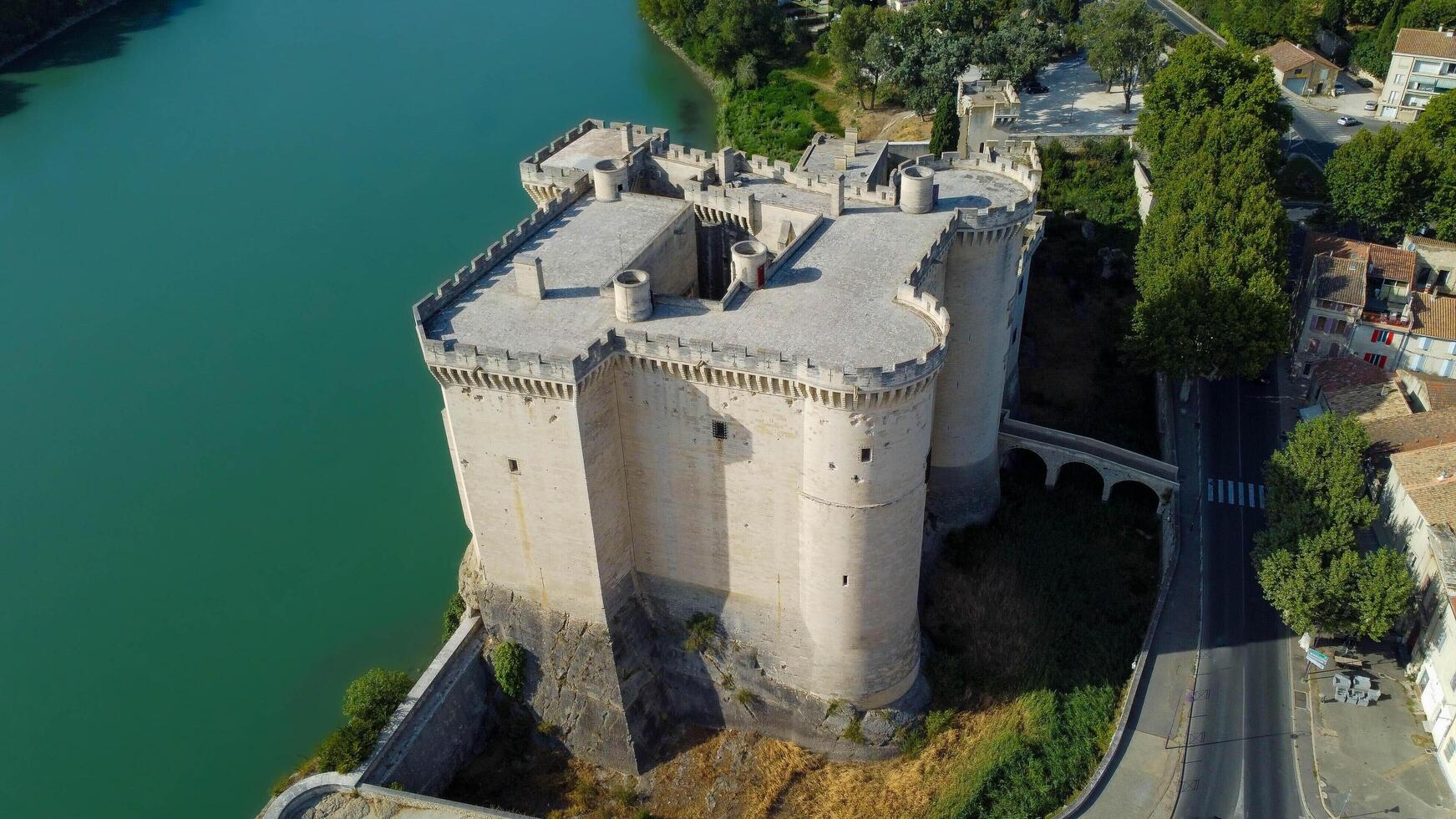Magnificent medieval castle in Tarascon, a French town located in the Bouches-du-Rhone department of the Provence-Alpes-Cote d'Azur. City of Tarascon seen from a drone, tourist travel destination. photo