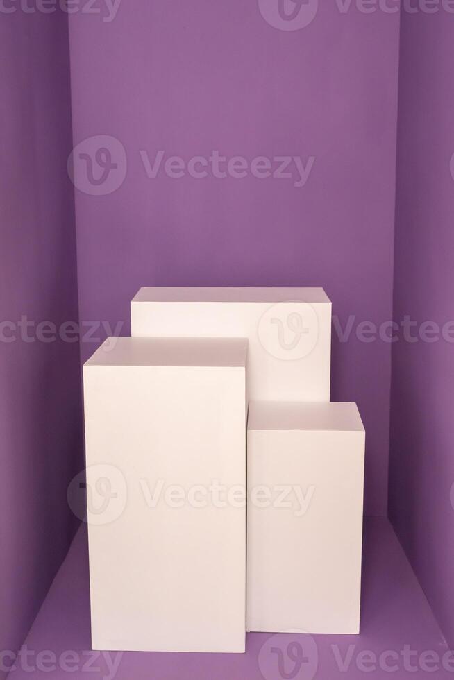 Three white rectangular boxes against purple background. Product photography mockup photo