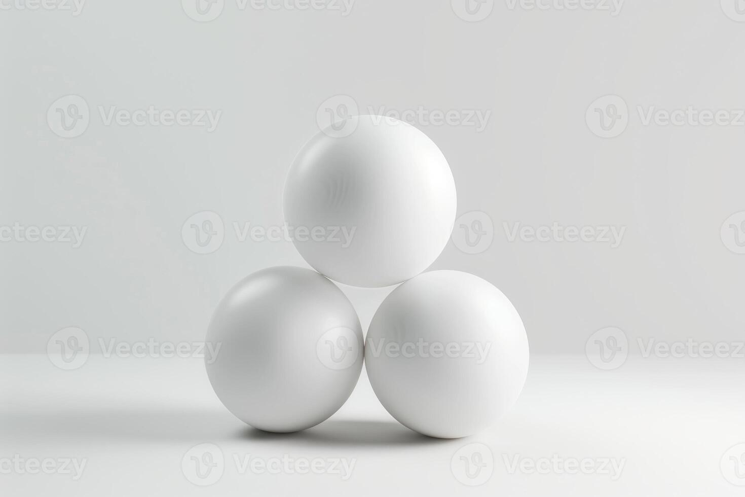 Three white spheres arranged in a triangle on a minimalistic background photo