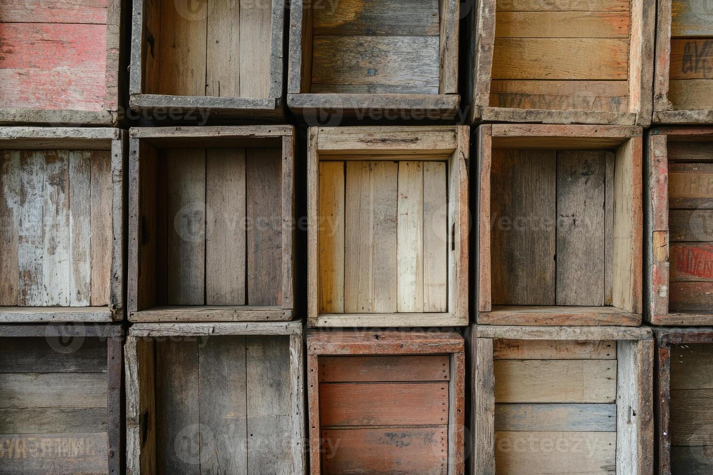 Wooden crates stacked against a wall showcasing various colors and textures in a rustic setting photo