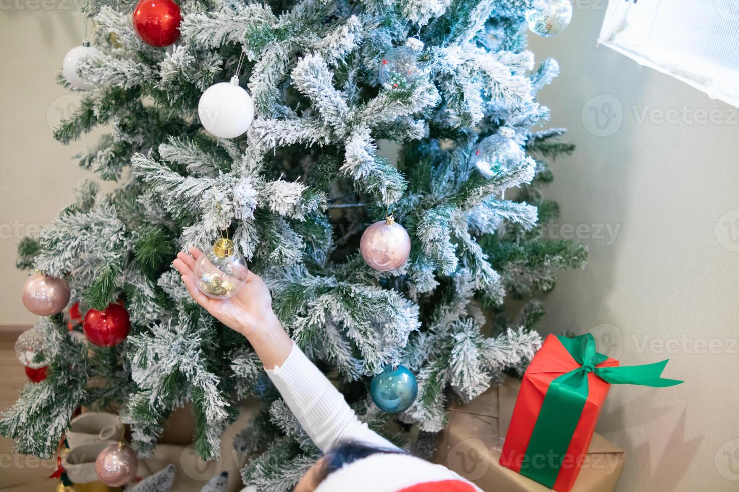 The Christmas tree is decorated with small toys and balls to brighten up the Christmas season and the Christmas tree is always green in every season. It represents the eternity of the Lord Jesus. photo