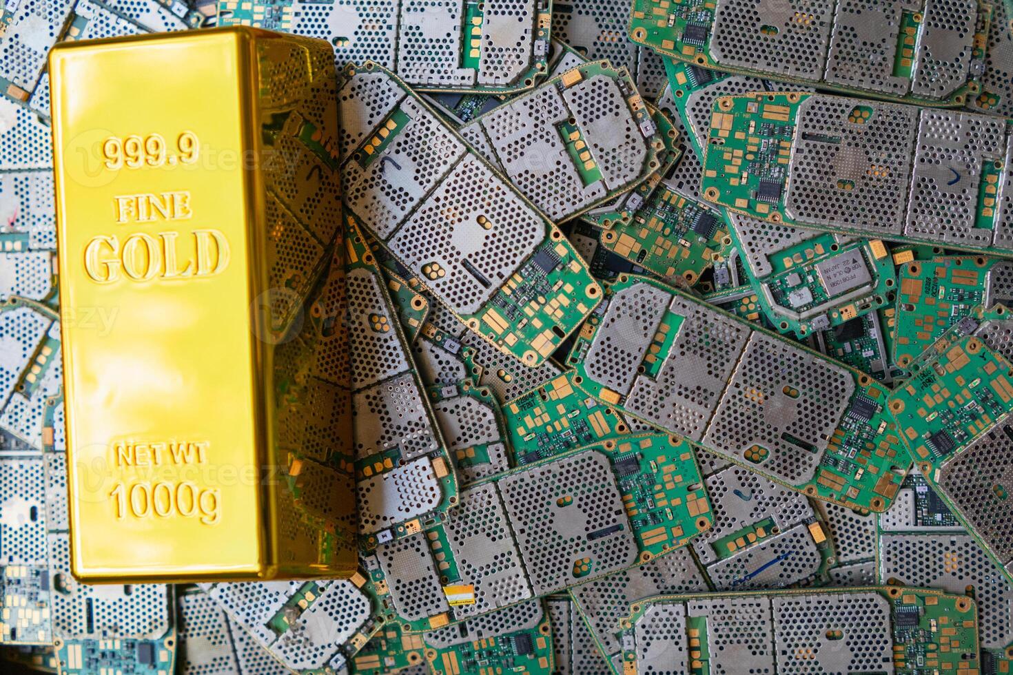 pile of electronic waste on factory floor is circuit board of mobile phone waiting to be processed extract gold to separate precious metal from electronic waste. extracting precious metal from e-waste photo