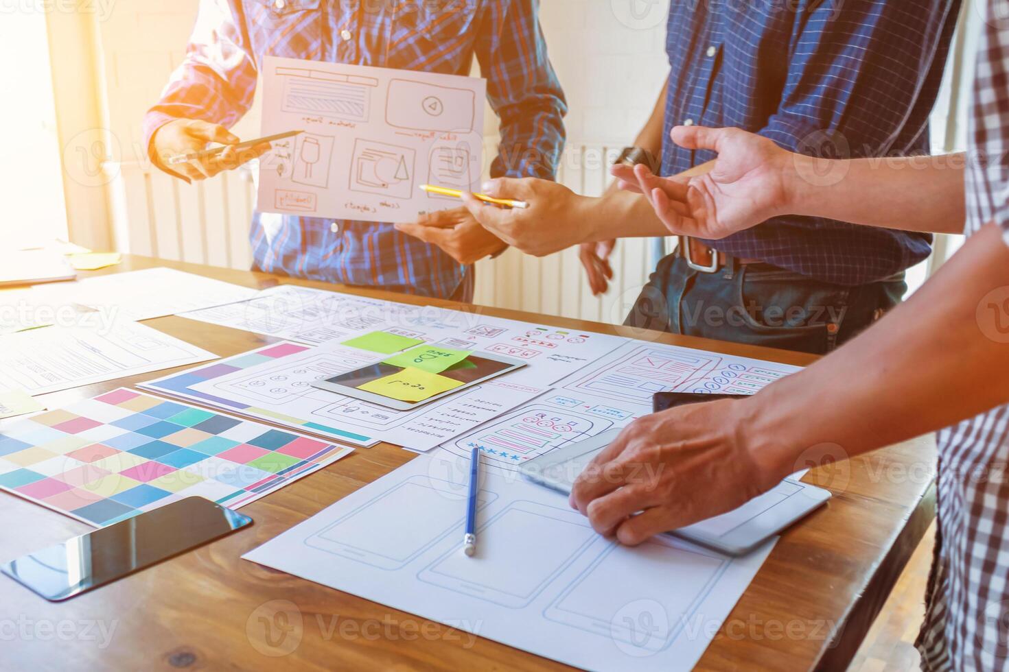 Smooth Focus, group of web designers are working together to develop mobile responsive website with UI UX Front End Designer Previewing. website designers in form of mobile applications with UI UX photo